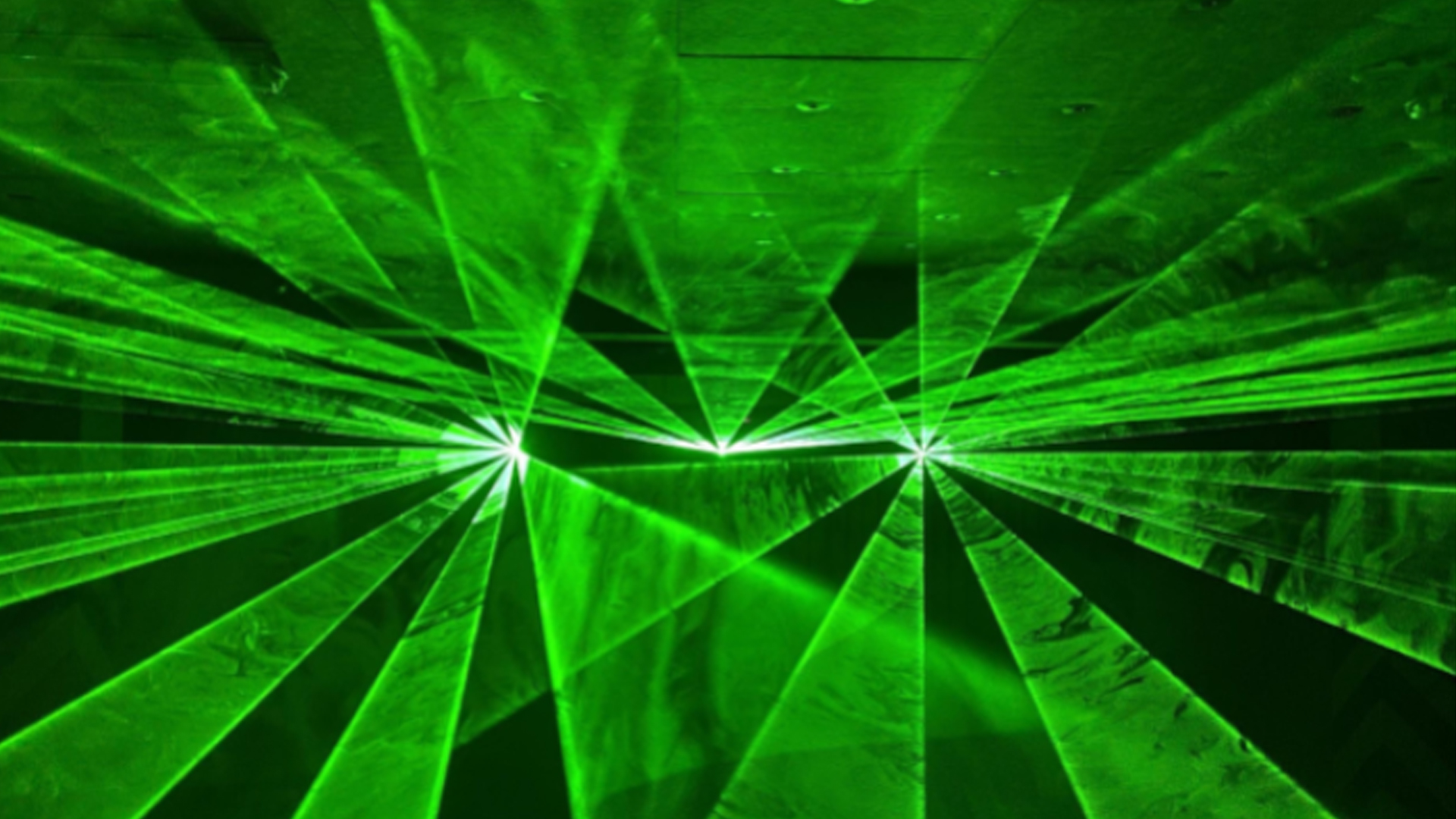 laser-lights Green laser lights being projceted by a 3D laser projected called Lasercube