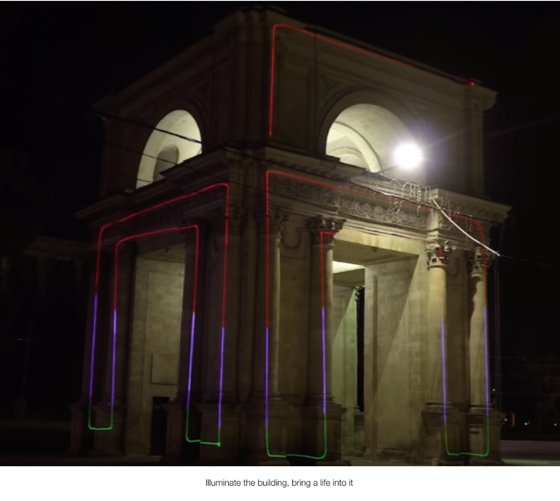 Ill-img An old traditional roman structure with laser lights projected onto from a lasercube, showcasing how it can be used for outdoor advertising