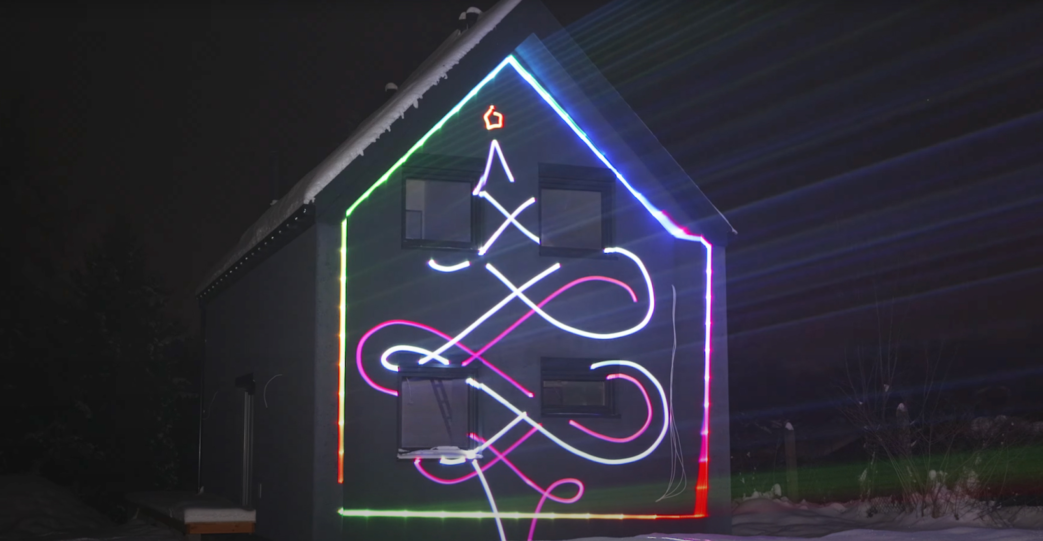 blog-1080 House lit up by a Christmas Light Laser Projector showing Christmas laser show effects