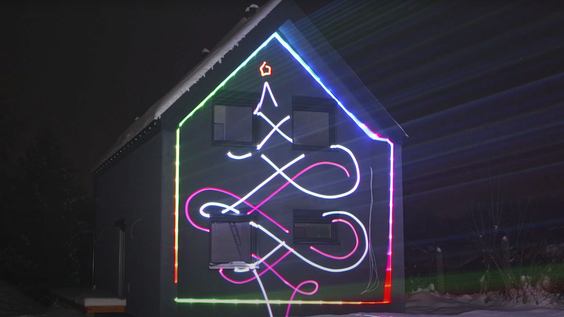 blog-1920-1 House lit up by a Christmas Light Laser Projector showing Christmas laser show effects