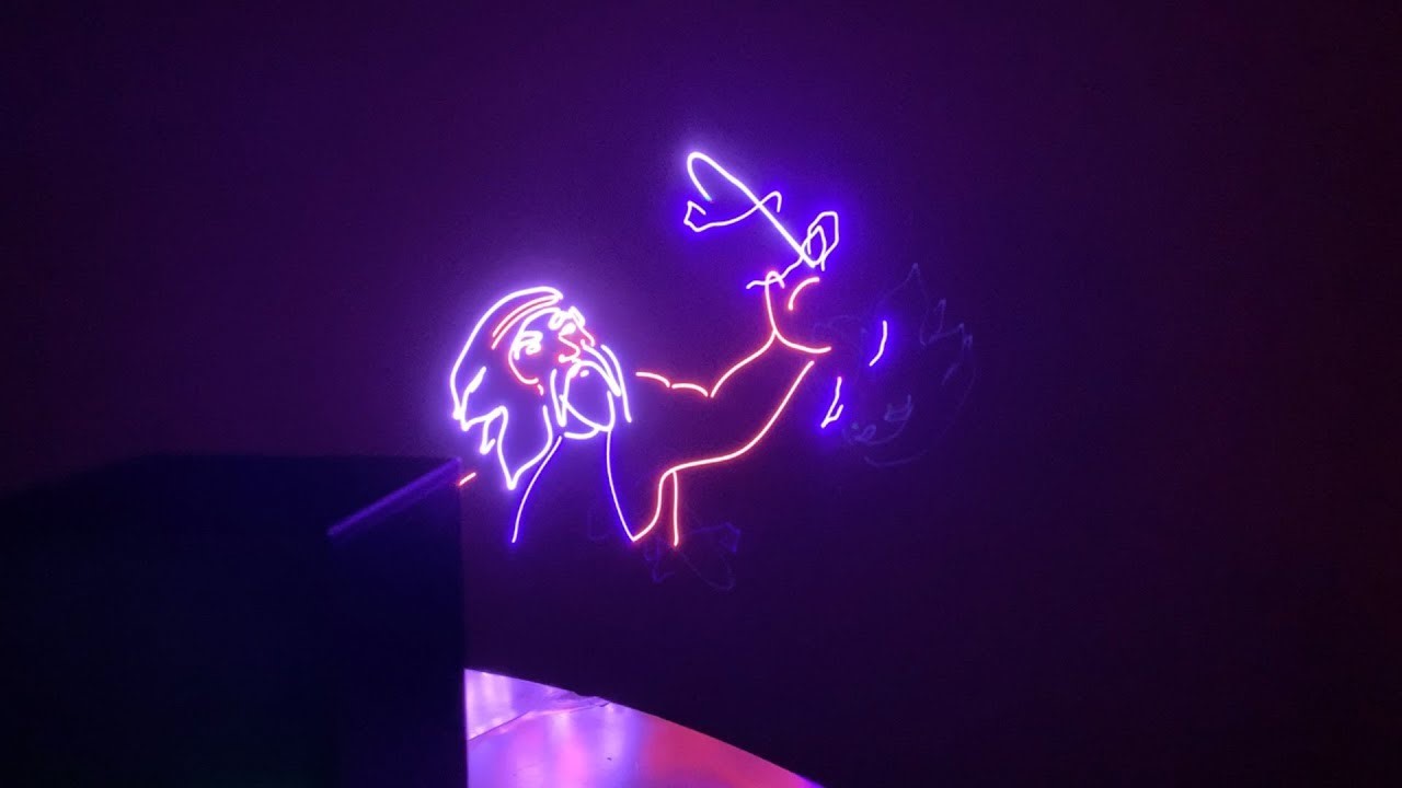 5 Laser animation lights created by the lasercube projector, showing the outline of an bearded man holding a sword.