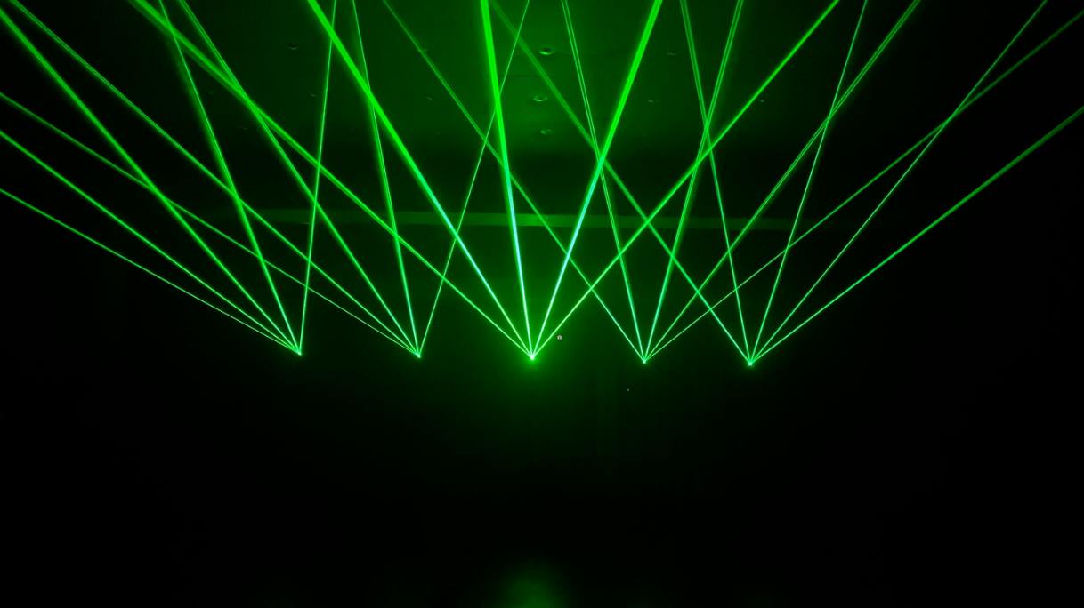 8 Green laser show lights created by the LaserCube projector